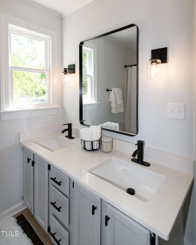 3317 E Jameson Rd, Raleigh, NC 27604 - full bathroom featuring double vanity and ornamental molding