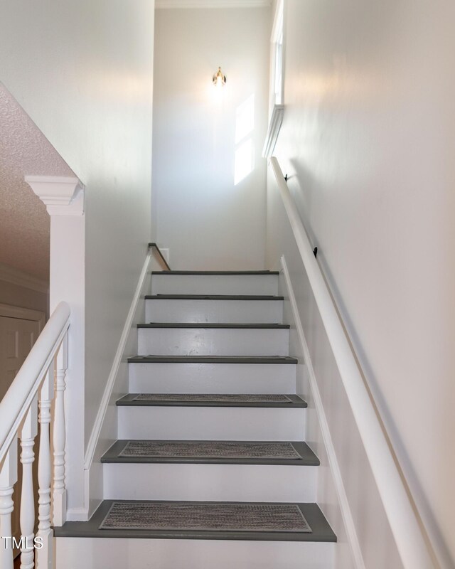 3317 E Jameson Rd, Raleigh, NC 27604 - stairs with a textured ceiling and ornamental molding