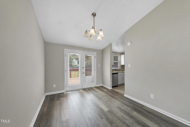5529 Wood Pond Ct, Raleigh, NC 27610 - unfurnished dining area featuring a chandelier, baseboards, wood finished floors, a sink, and lofted ceiling