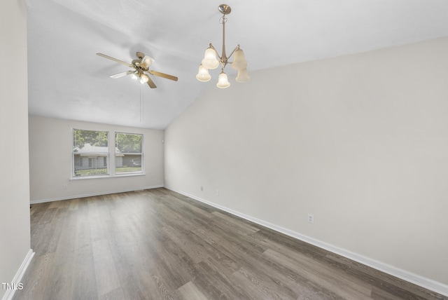 5529 Wood Pond Ct, Raleigh, NC 27610 - empty room with wood finished floors, ceiling fan, baseboards, and lofted ceiling