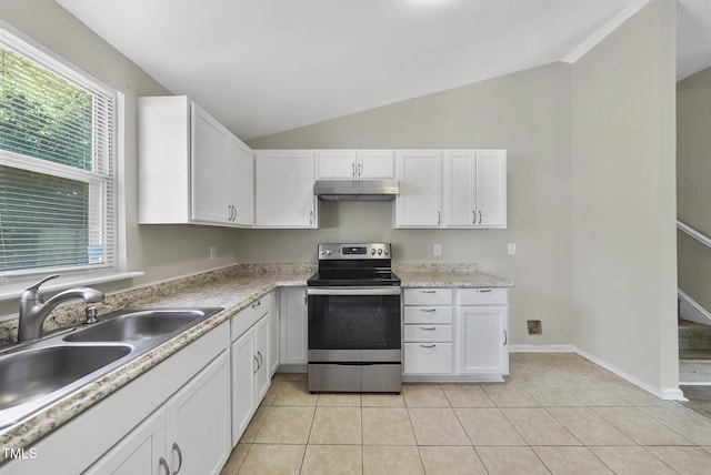 5529 Wood Pond Ct, Raleigh, NC 27610 - kitchen with stainless steel electric stove, under cabinet range hood, vaulted ceiling, white cabinets, and light countertops