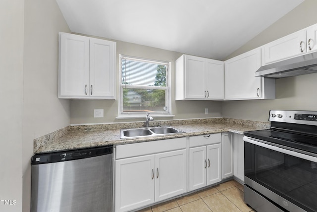 5529 Wood Pond Ct, Raleigh, NC 27610 - kitchen featuring appliances with stainless steel finishes, under cabinet range hood, lofted ceiling, a sink, and white cabinets
