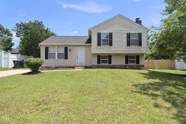 5529 Wood Pond Ct, Raleigh, NC 27610 - split level home featuring a chimney and entry steps