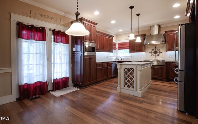 2109 Taramar Ln, Zebulon, NC 27597 - kitchen with wall chimney range hood, stainless steel appliances, crown molding, decorative backsplash, and dark wood finished floors