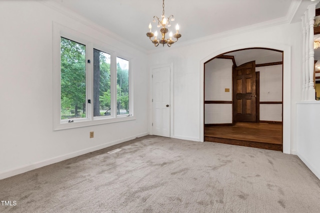 1164 Keith Hills Rd, Lillington, NC 27546 - spare room with crown molding, arched walkways, carpet floors, a chandelier, and baseboards