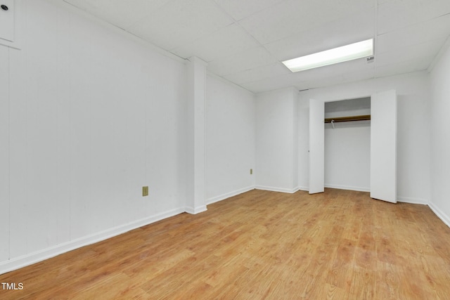 1164 Keith Hills Rd, Lillington, NC 27546 - unfurnished bedroom with light wood-style floors, a drop ceiling, and baseboards