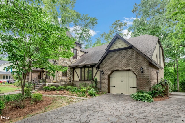 1164 Keith Hills Rd, Lillington, NC 27546 - view of front of house featuring a garage, brick siding, driveway, and a shingled roof