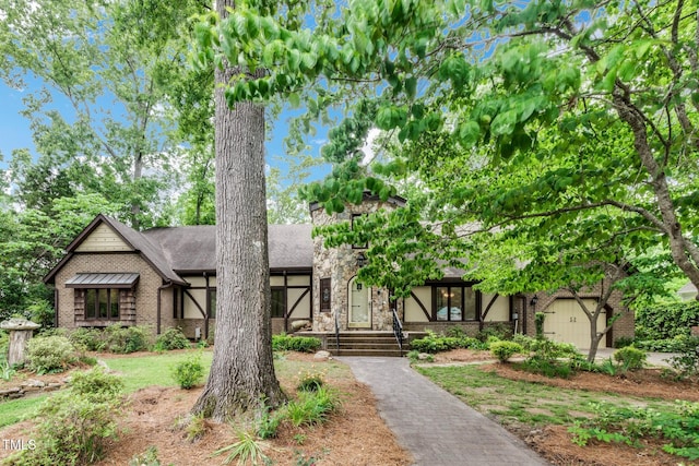 1164 Keith Hills Rd, Lillington, NC 27546 - tudor-style house featuring brick siding and a shingled roof