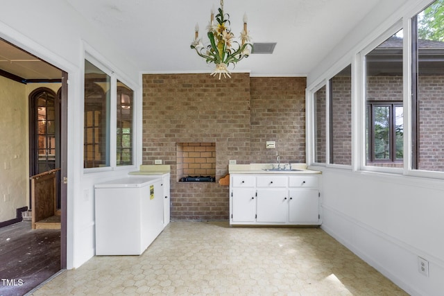 1164 Keith Hills Rd, Lillington, NC 27546 - unfurnished sunroom featuring a sink and a chandelier