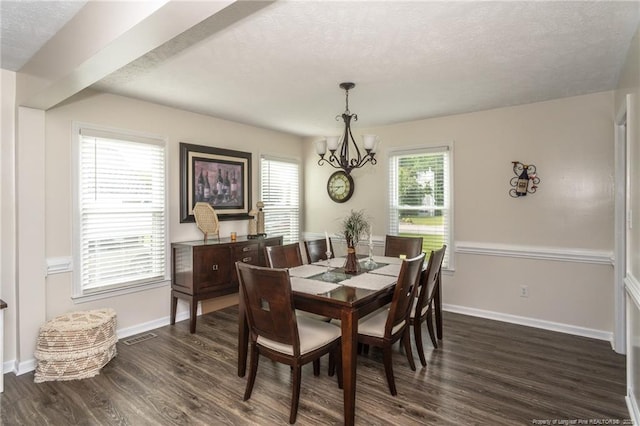 3538 Gables Dr, Fayetteville, NC 28311 - dining space with a chandelier, dark wood-style floors, a textured ceiling, and baseboards