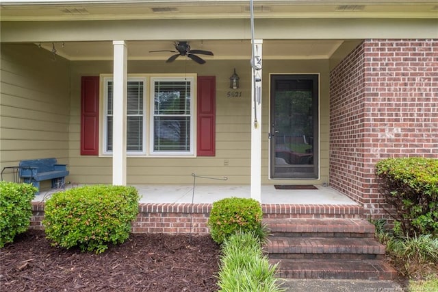 5621 Monks Walk Ct, Fayetteville, NC 28311 - property entrance with a porch, a ceiling fan, and brick siding