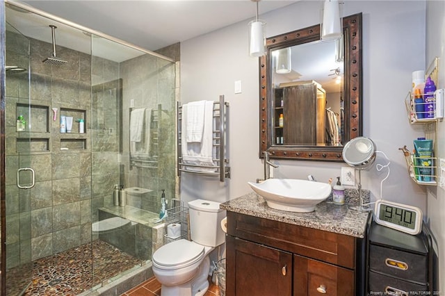 5621 Monks Walk Ct, Fayetteville, NC 28311 - full bath featuring vanity, a shower stall, radiator heating unit, and toilet