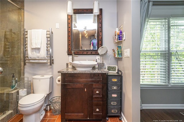 5621 Monks Walk Ct, Fayetteville, NC 28311 - bathroom featuring vanity, a shower stall, radiator, toilet, and baseboards