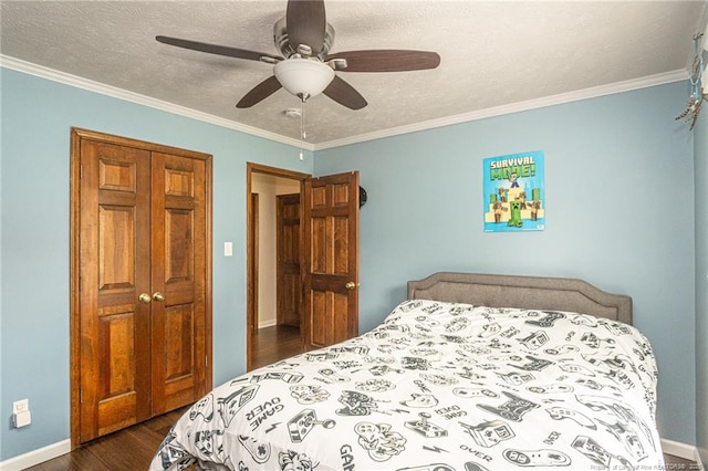5621 Monks Walk Ct, Fayetteville, NC 28311 - bedroom with dark wood finished floors, ornamental molding, a closet, ceiling fan, and a textured ceiling