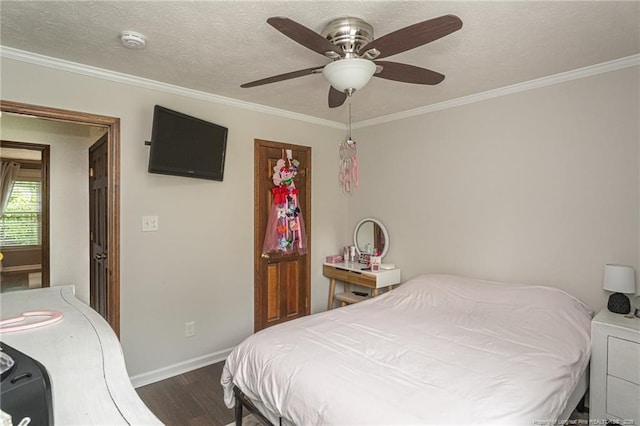 5621 Monks Walk Ct, Fayetteville, NC 28311 - bedroom featuring dark wood finished floors, baseboards, ornamental molding, and ceiling fan