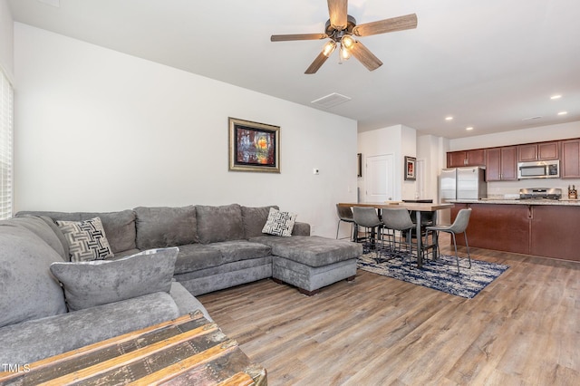 150 Sherrill Place Ln, Garner, NC 27529 - living room featuring light wood-style flooring, recessed lighting, and a ceiling fan