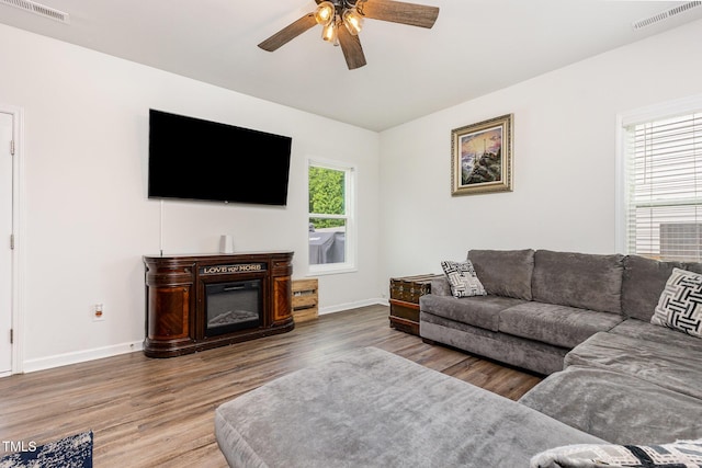 150 Sherrill Place Ln, Garner, NC 27529 - living area with wood finished floors and ceiling fan
