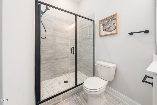 20 Scotland Dr, Youngsville, NC 27596 - bathroom with toilet, baseboards, and a shower stall