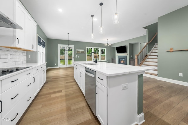 20 Scotland Dr, Youngsville, NC 27596 - kitchen with wall chimney range hood, stainless steel dishwasher, a sink, light wood-type flooring, and black electric stovetop