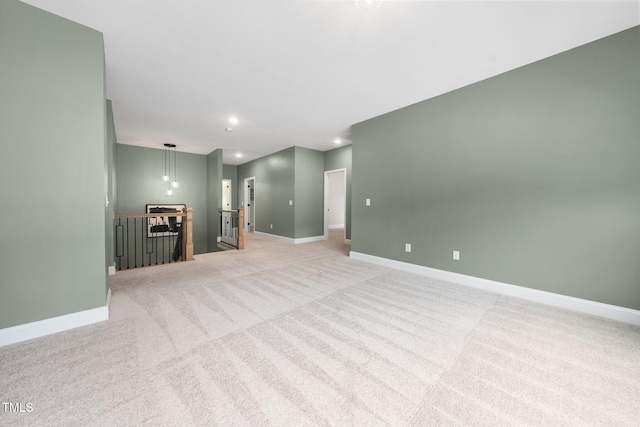 20 Scotland Dr, Youngsville, NC 27596 - unfurnished living room featuring light colored carpet, baseboards, and recessed lighting