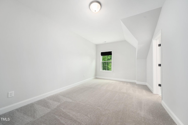 20 Scotland Dr, Youngsville, NC 27596 - additional living space featuring light colored carpet, lofted ceiling, and baseboards