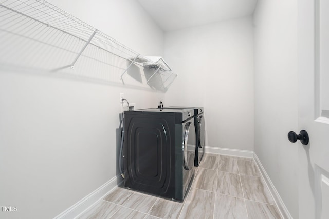 20 Scotland Dr, Youngsville, NC 27596 - laundry area with washing machine and dryer and baseboards