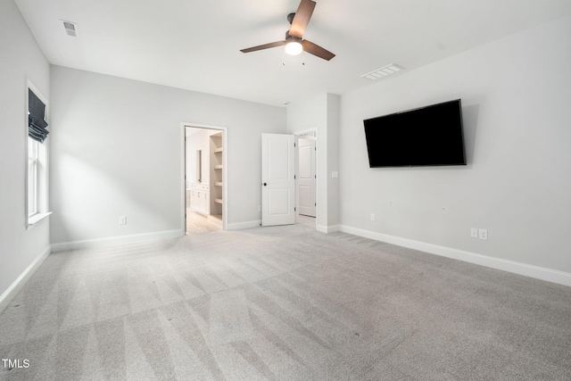20 Scotland Dr, Youngsville, NC 27596 - unfurnished bedroom featuring light carpet, baseboards, connected bathroom, and a ceiling fan