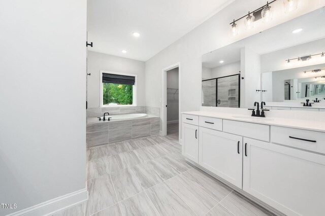 20 Scotland Dr, Youngsville, NC 27596 - full bathroom with vanity, a bath, a shower stall, and recessed lighting