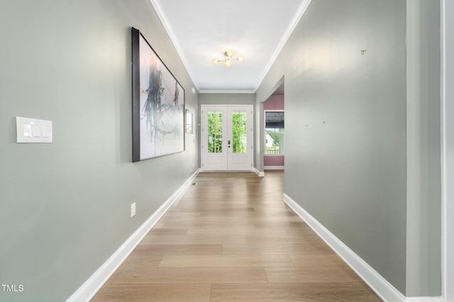 20 Scotland Dr, Youngsville, NC 27596 - corridor with ornamental molding, french doors, baseboards, and light wood-style floors