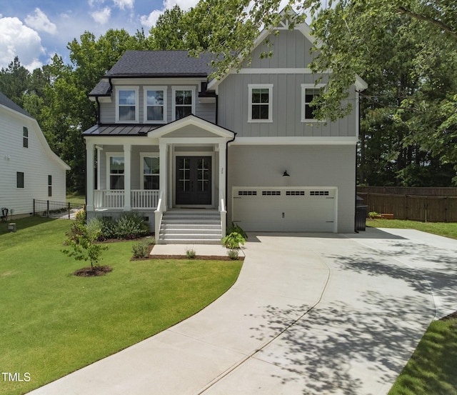 20 Scotland Dr, Youngsville, NC 27596 - craftsman inspired home with an attached garage, covered porch, concrete driveway, a standing seam roof, and board and batten siding