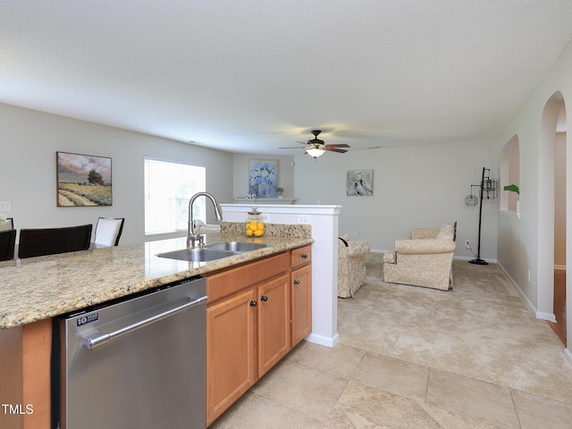 3515 Mountain Brook Cir, Durham, NC 27704 - kitchen featuring dishwasher, a sink, light colored carpet, a ceiling fan, and open floor plan