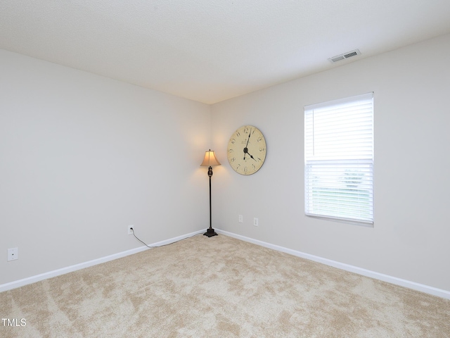 3515 Mountain Brook Cir, Durham, NC 27704 - spare room featuring carpet and baseboards