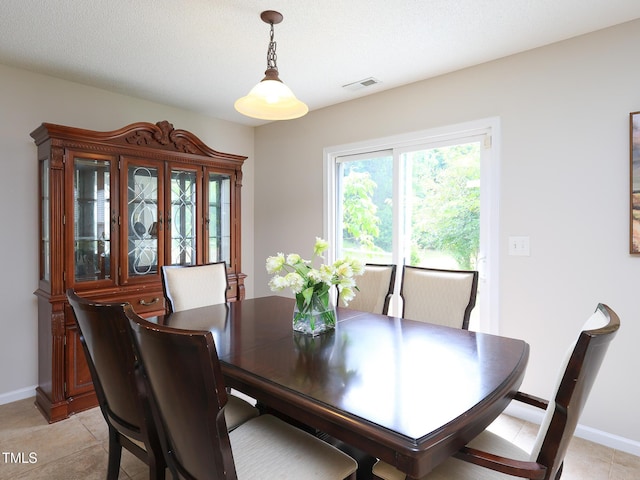 3515 Mountain Brook Cir, Durham, NC 27704 - dining space featuring baseboards and light tile patterned floors