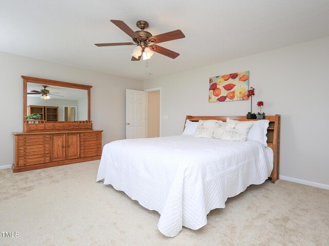 3515 Mountain Brook Cir, Durham, NC 27704 - bedroom with light carpet, baseboards, and a ceiling fan
