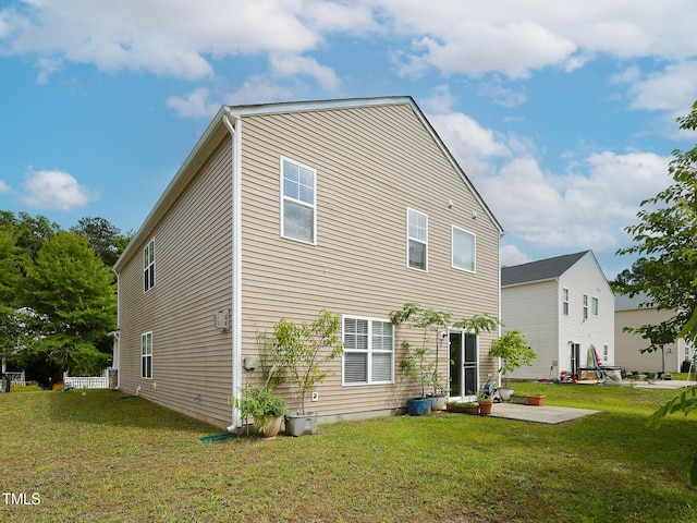 3515 Mountain Brook Cir, Durham, NC 27704 - rear view of house with a patio area and a yard