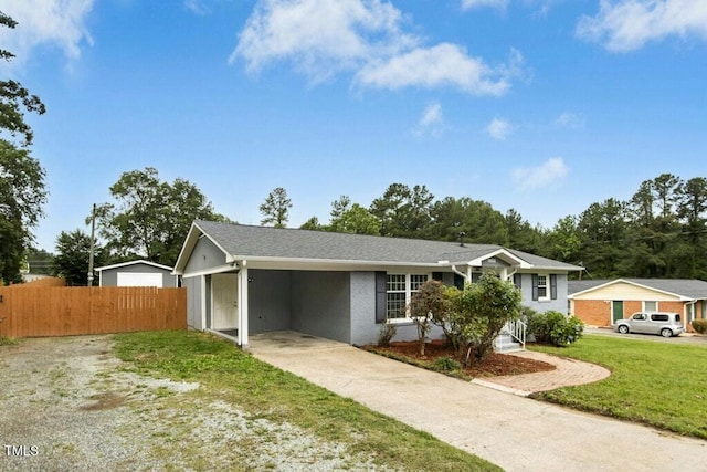 4021 Chaucer Dr, Durham, NC 27705 - ranch-style home with driveway and an attached carport