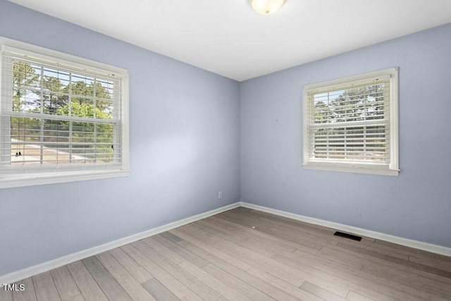 4021 Chaucer Dr, Durham, NC 27705 - spare room with wood finished floors and baseboards