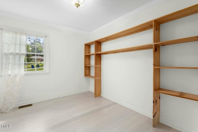 4021 Chaucer Dr, Durham, NC 27705 - unfurnished bedroom featuring light wood-style floors, crown molding, and baseboards