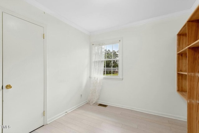 4021 Chaucer Dr, Durham, NC 27705 - unfurnished room with crown molding, light wood-style floors, and baseboards