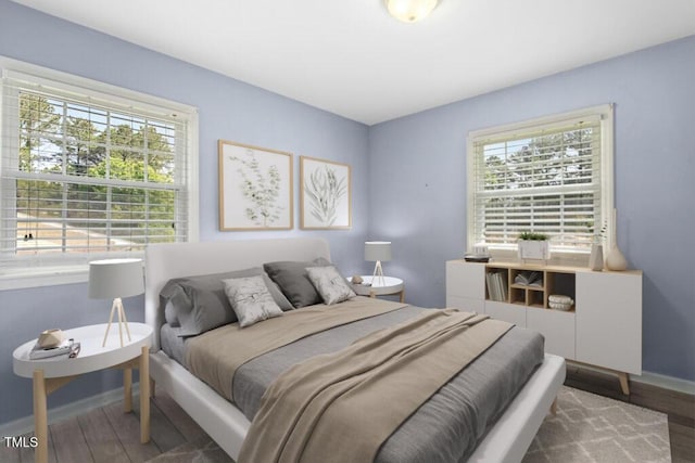 4021 Chaucer Dr, Durham, NC 27705 - bedroom with baseboards and wood finished floors