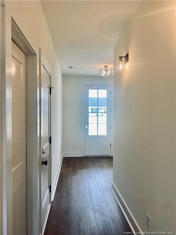 285 Delmore Rd, Autryville, NC 28318 - entryway with dark wood-type flooring and baseboards