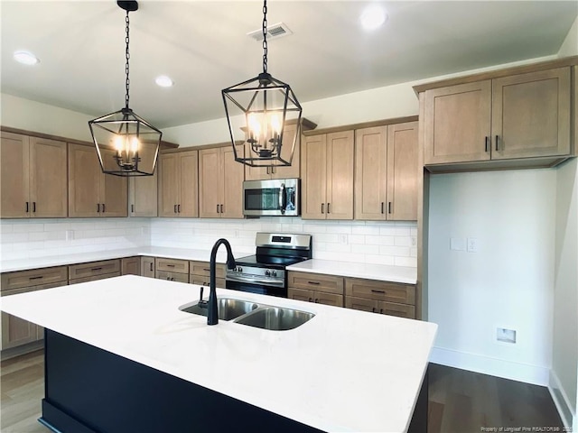 285 Delmore Rd, Autryville, NC 28318 - kitchen with stainless steel appliances, a chandelier, backsplash, and recessed lighting
