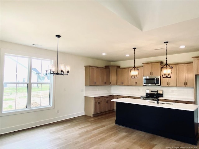 285 Delmore Rd, Autryville, NC 28318 - kitchen featuring stainless steel appliances, a sink, decorative backsplash, light countertops, and recessed lighting