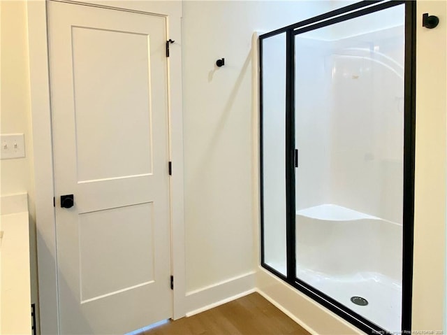 285 Delmore Rd, Autryville, NC 28318 - full bathroom with a stall shower, wood finished floors, and baseboards