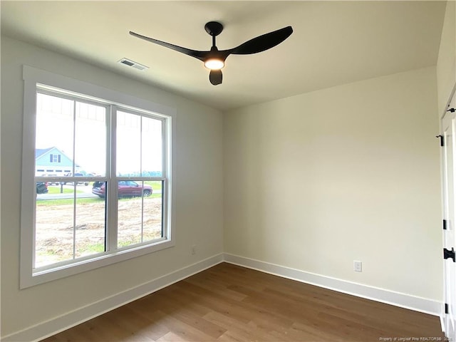 285 Delmore Rd, Autryville, NC 28318 - unfurnished room featuring baseboards, dark wood finished floors, and a ceiling fan