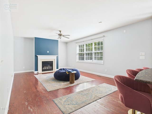 1728 Callandale Ave, Cary, NC 27518 - living area with hardwood / wood-style floors, ceiling fan, baseboards, and a glass covered fireplace