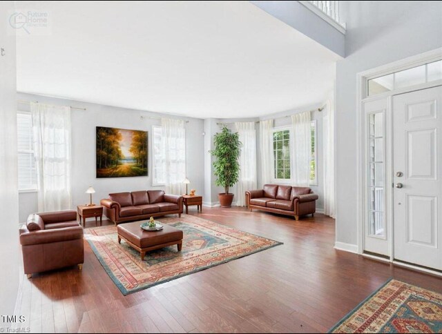 1728 Callandale Ave, Cary, NC 27518 - living room with wood finished floors, healthy amount of natural light, and baseboards