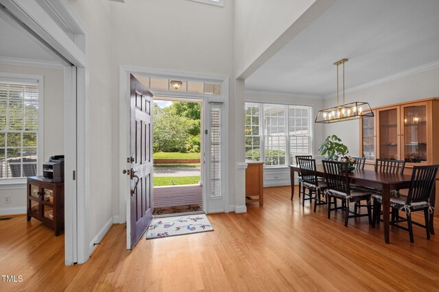 100 Maywood Way, Chapel Hill, NC 27516 - entryway featuring light wood-type flooring, a chandelier, ornamental molding, and baseboards