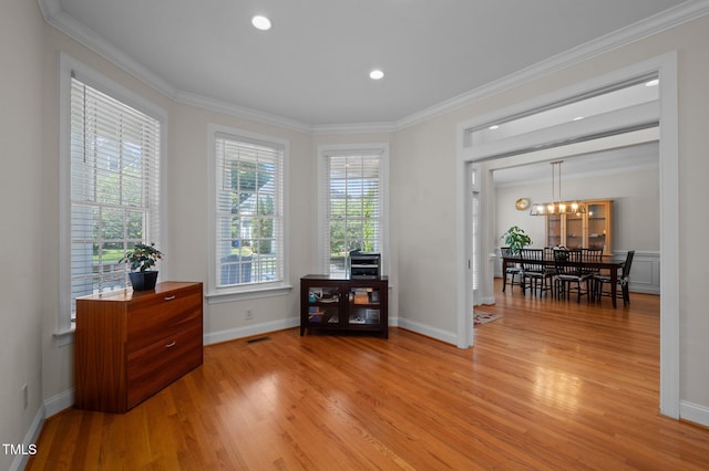 100 Maywood Way, Chapel Hill, NC 27516 - sitting room with light wood finished floors, crown molding, baseboards, a chandelier, and recessed lighting