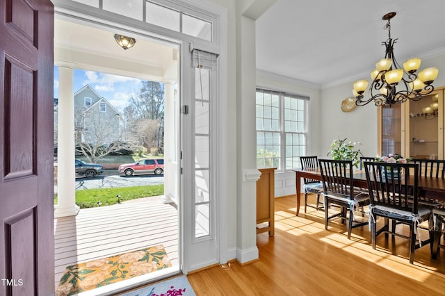 100 Maywood Way, Chapel Hill, NC 27516 - entrance foyer featuring ornamental molding, light wood-style floors, a chandelier, decorative columns, and baseboards